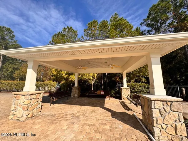 a view of a swimming pool with a patio