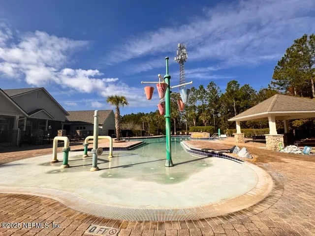 a view of a house with snow on the side of the road