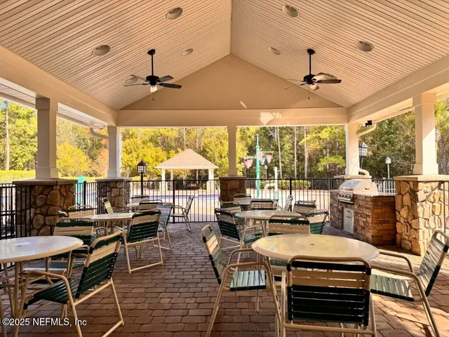 a living room with furniture a wooden floor and a fireplace