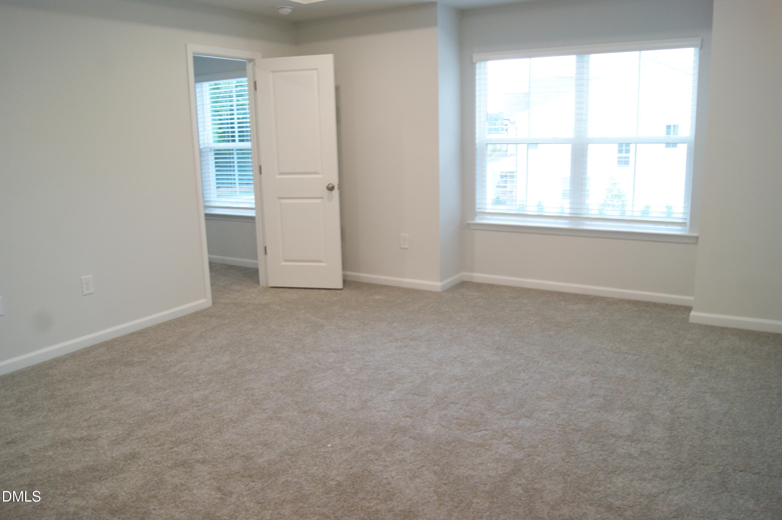 295 Glenmore Gardens Road Raleigh, NC 27603 - Photo 12 of 30 an empty room with windows