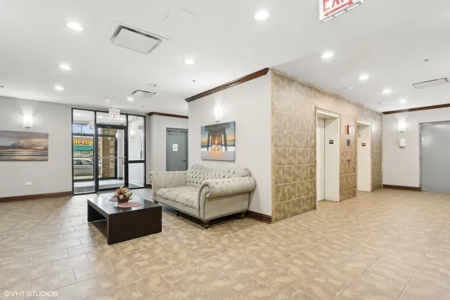 a living room with furniture and white walls
