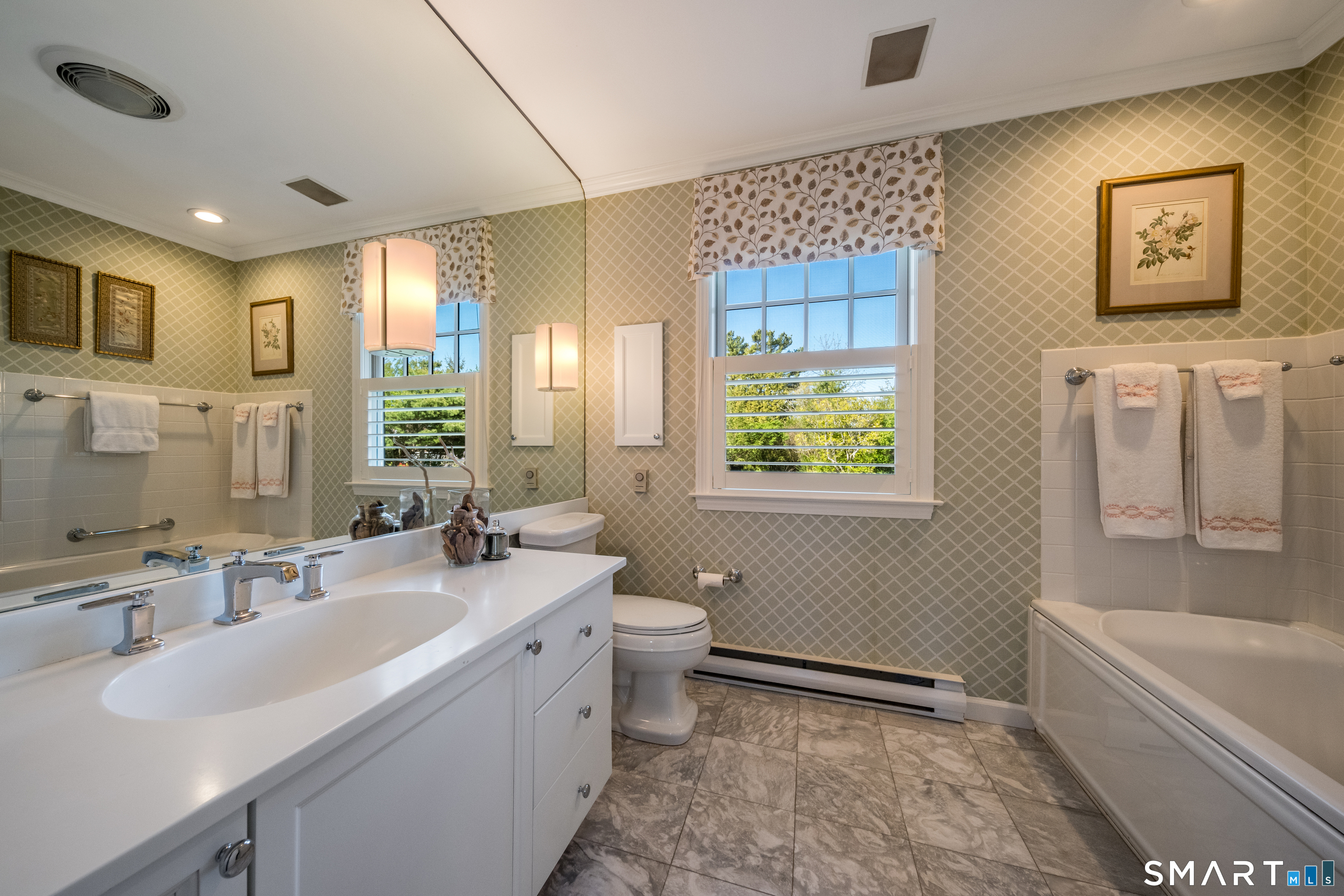 28 Walden Hill Road Guilford, CT 06437 - Photo 15 of 35 a bathroom with a bathtub sink mirror vanity and toilet