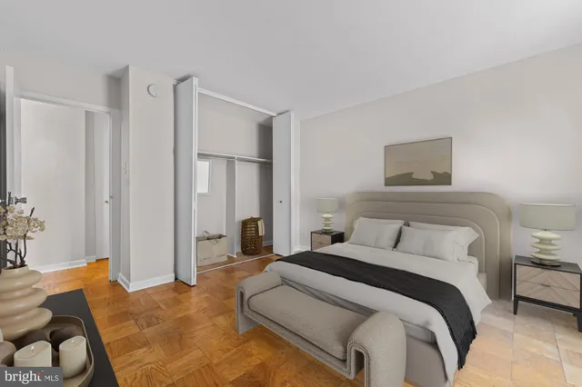 a bedroom with a bed and a couch