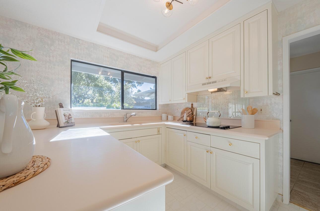 33 Country Club Gate Pacific Grove, CA 93950 - Photo 18 of 40 a kitchen with a sink cabinets and window