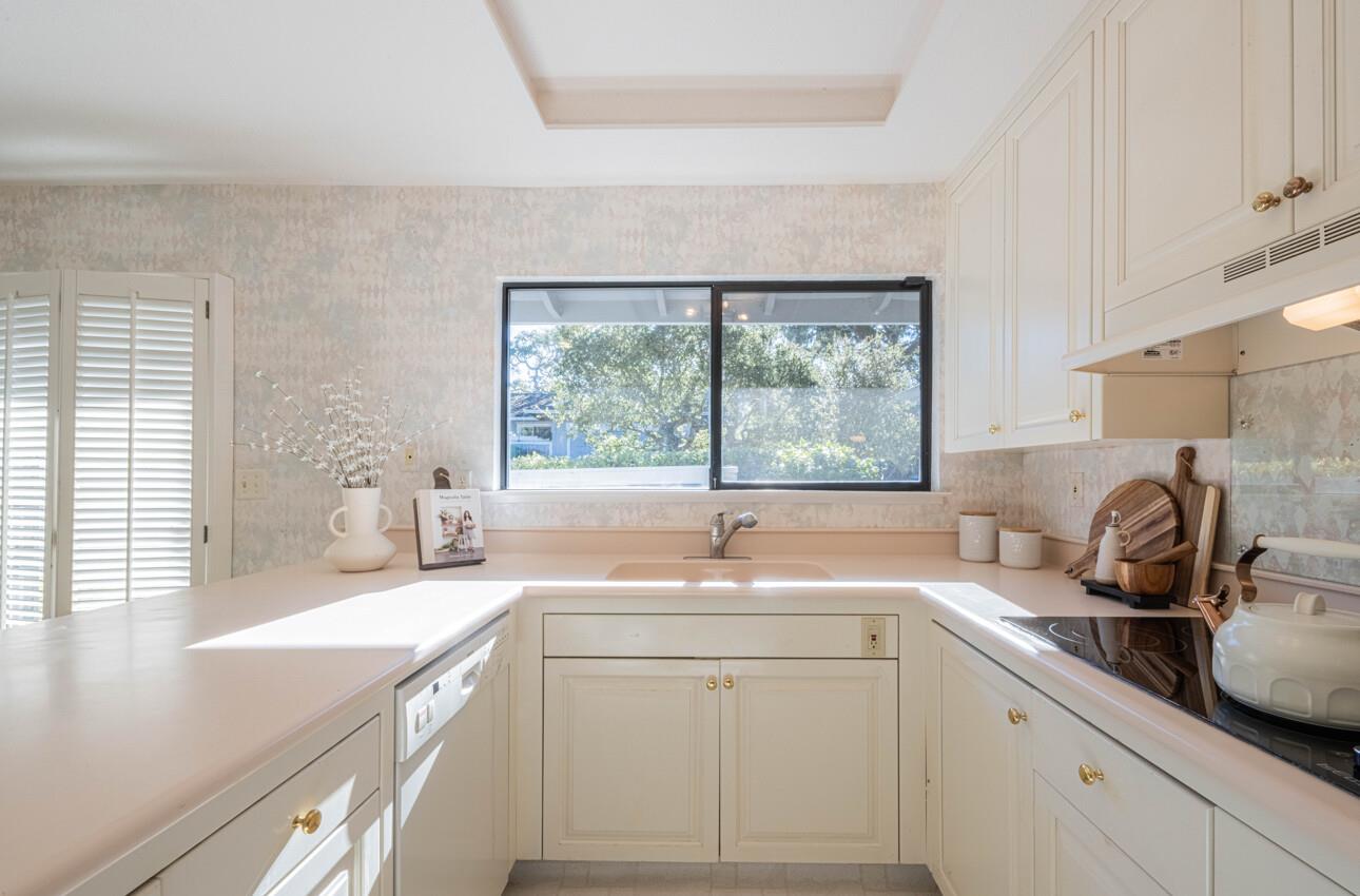 33 Country Club Gate Pacific Grove, CA 93950 - Photo 19 of 40 a kitchen with a sink a window and cabinets