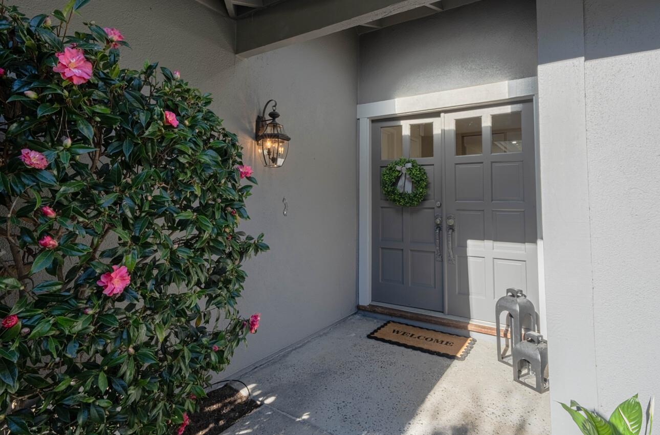 33 Country Club Gate Pacific Grove, CA 93950 - Photo 2 of 40 a potted plant sitting in front of a house