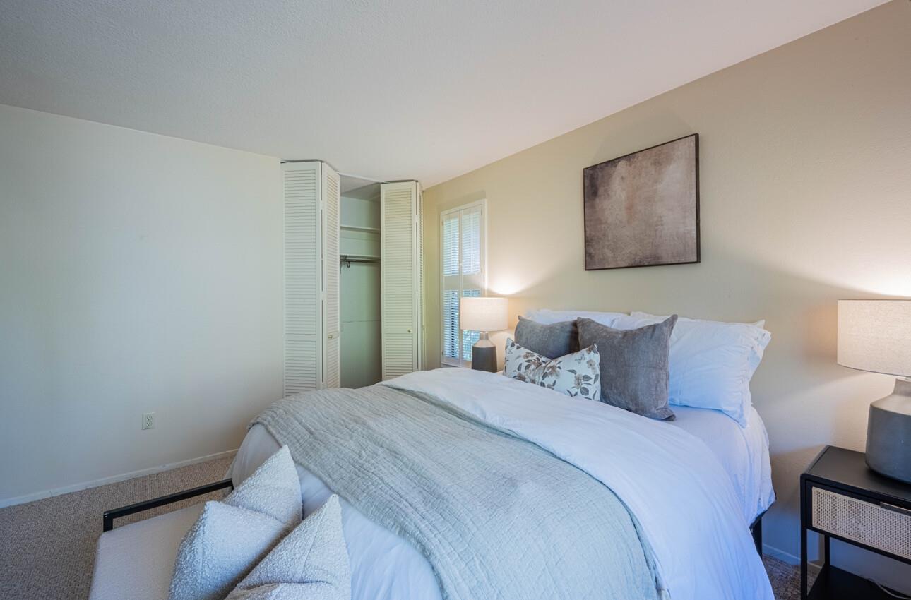 33 Country Club Gate Pacific Grove, CA 93950 - Photo 26 of 40 a bedroom with a bed and a painting on the wall