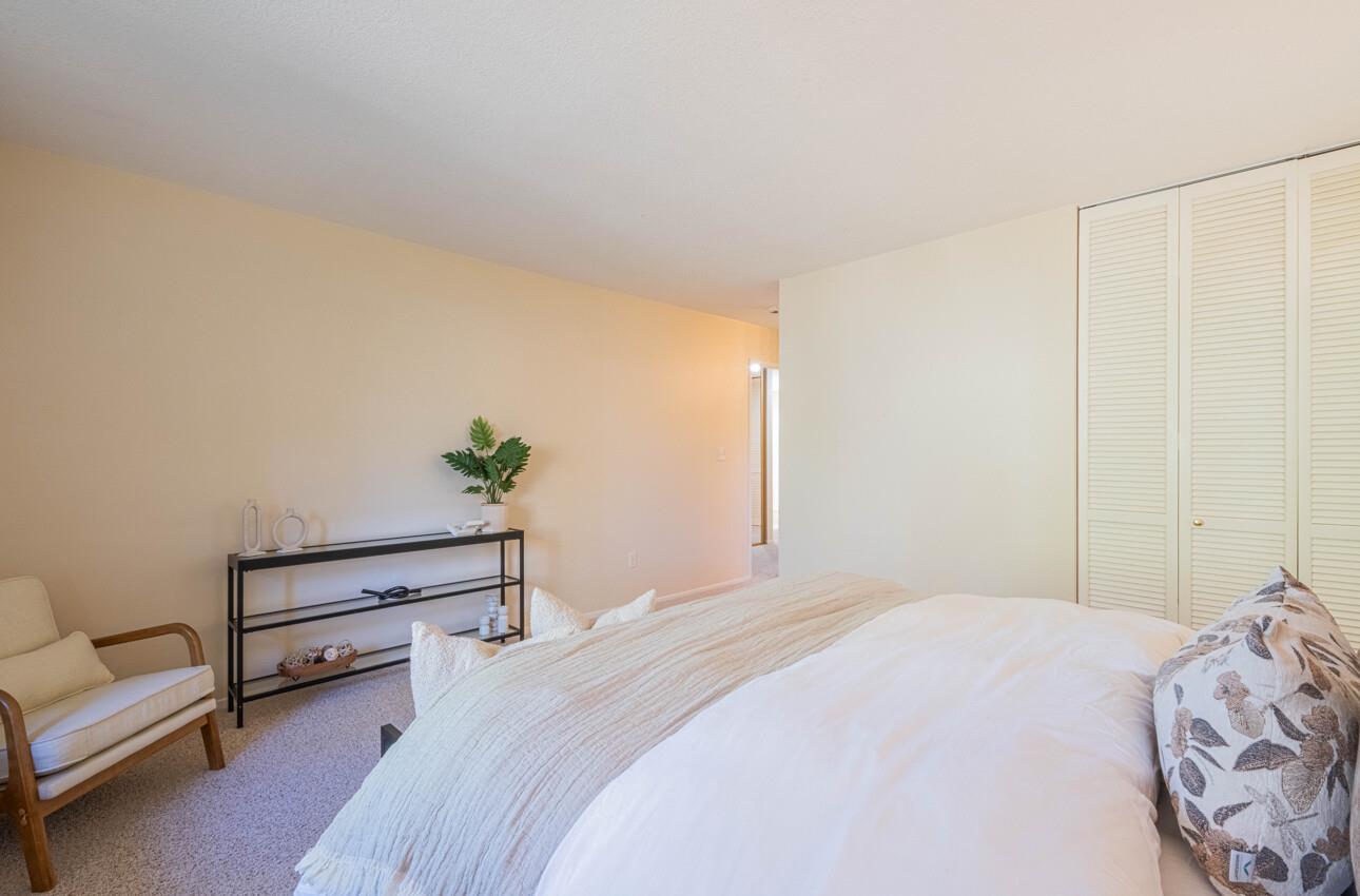 33 Country Club Gate Pacific Grove, CA 93950 - Photo 28 of 40 a bedroom with a bed and a potted plant