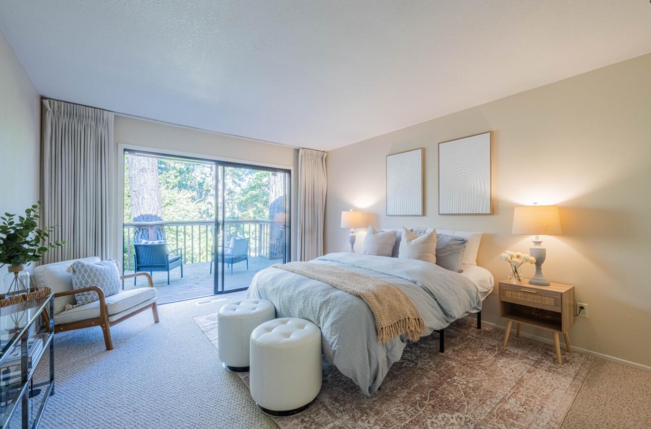 33 Country Club Gate Pacific Grove, CA 93950 - Photo 31 of 40 a bedroom with a bed and large windows