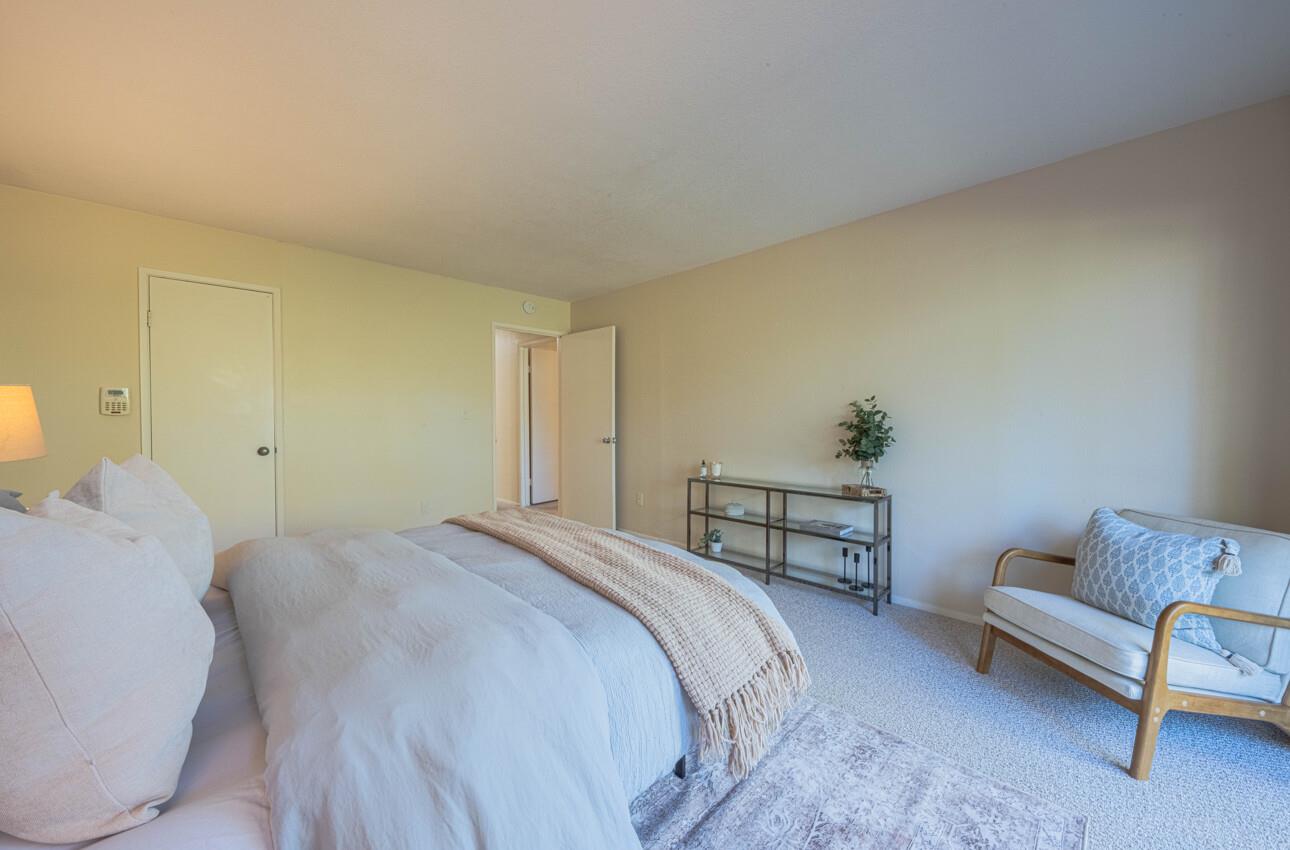 33 Country Club Gate Pacific Grove, CA 93950 - Photo 34 of 40 a bedroom with a bed and a couch