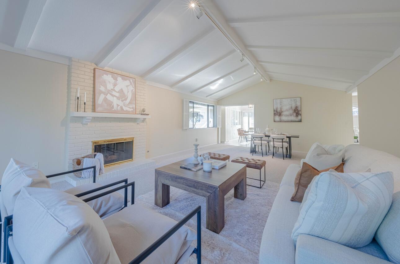 33 Country Club Gate Pacific Grove, CA 93950 - Photo 9 of 40 a living room with furniture a fireplace and a table