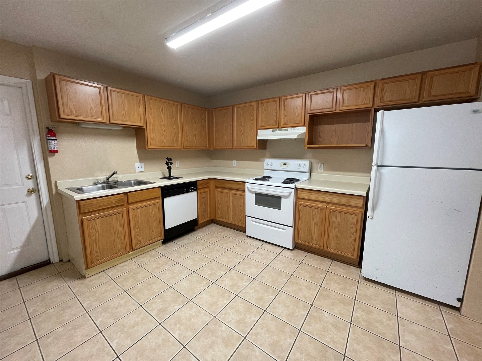 11241 Terra Loop Road San Antonio, TX 78233 - Photo 2 of 5 A well-appointed kitchen features ample cabinetry and practical tile flooring.