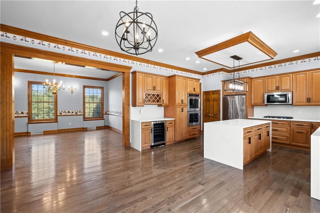 129 Purvis Road Butler, PA 16001 - Photo 11 of 50 a view of a livingroom with furniture wooden floor and a kitchen