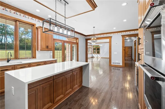 a view of a kitchen with a large window