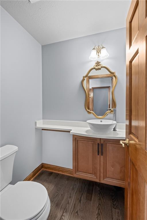 129 Purvis Road Butler, PA 16001 - Photo 20 of 50 a bathroom with a toilet sink and mirror