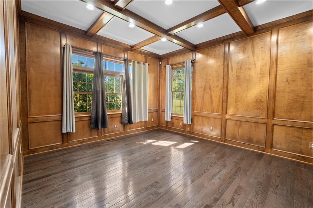 129 Purvis Road Butler, PA 16001 - Photo 21 of 50 a view of an empty room with wooden floor and a window