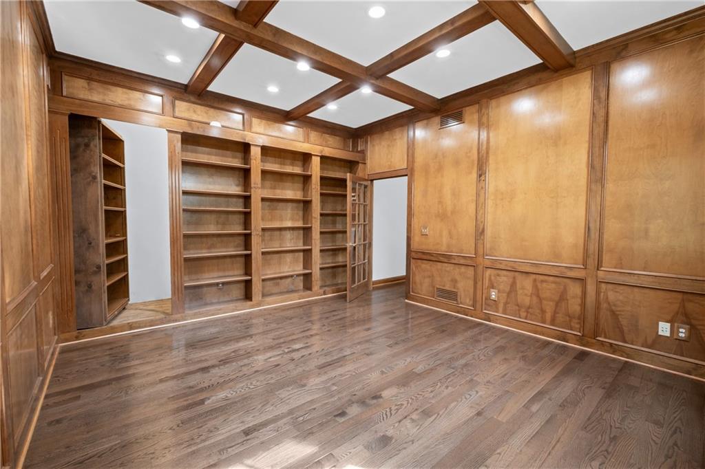 129 Purvis Road Butler, PA 16001 - Photo 22 of 50 a view of an empty room with wooden floor and a window