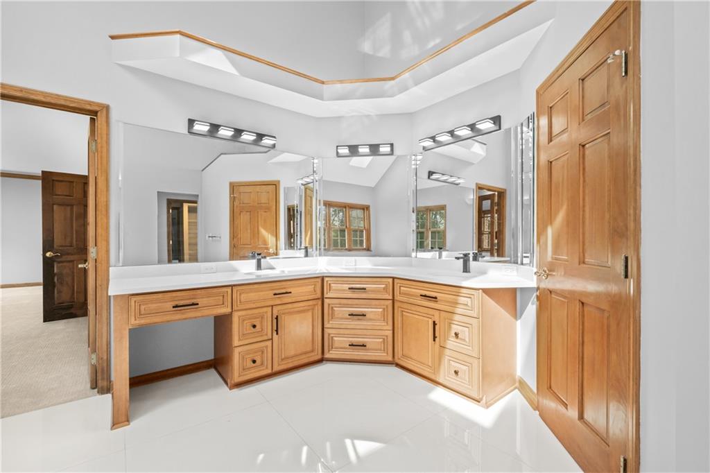 129 Purvis Road Butler, PA 16001 - Photo 30 of 50 a spacious bathroom with a granite countertop sink mirror and