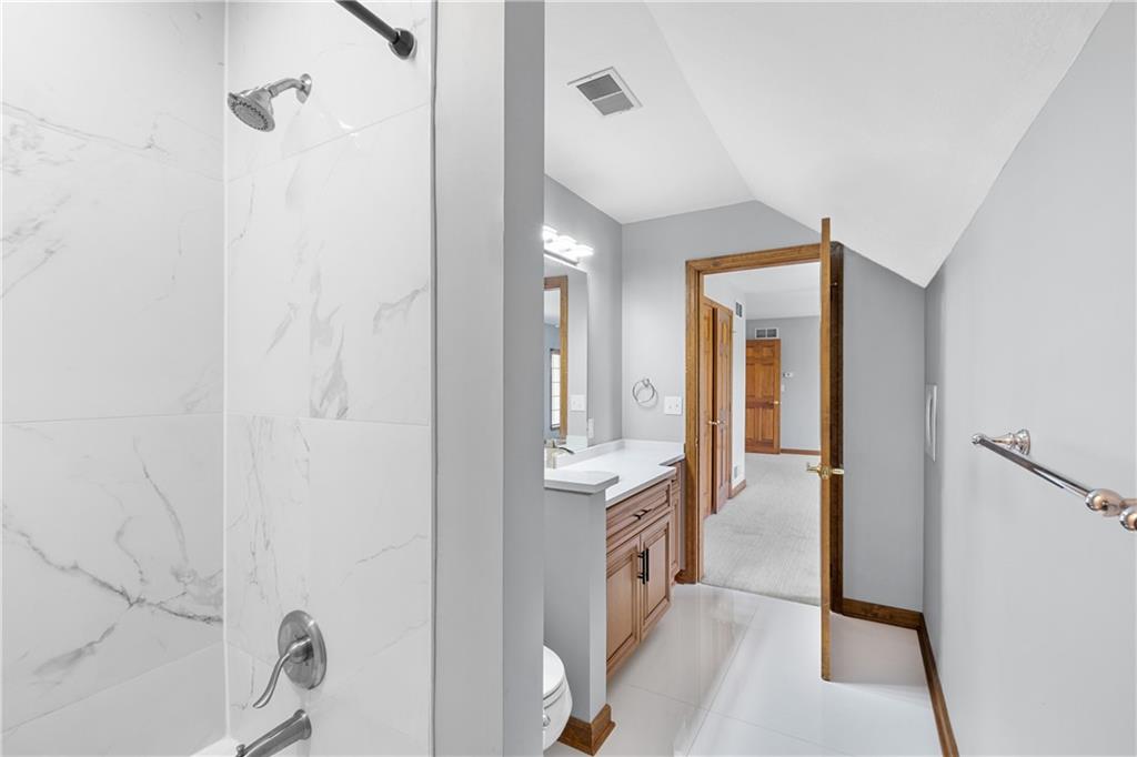 129 Purvis Road Butler, PA 16001 - Photo 38 of 50 a spacious bathroom with a shower and a mirror