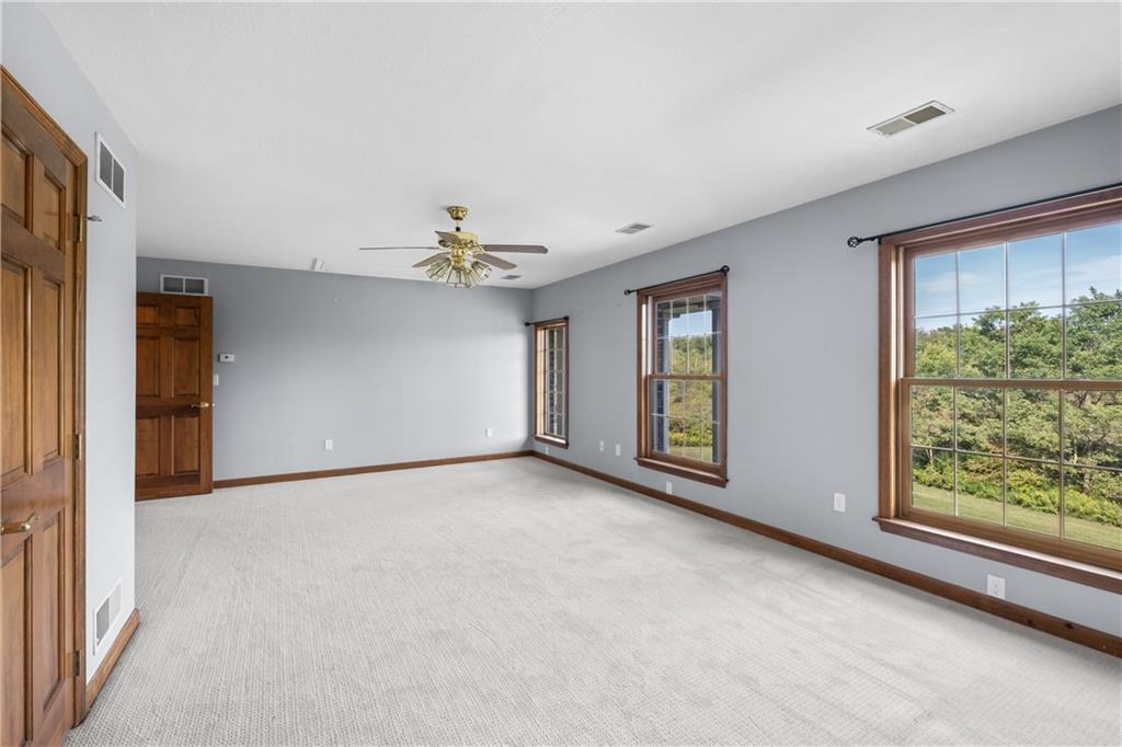 129 Purvis Road Butler, PA 16001 - Photo 39 of 50 a view of an empty room with window and cabinet