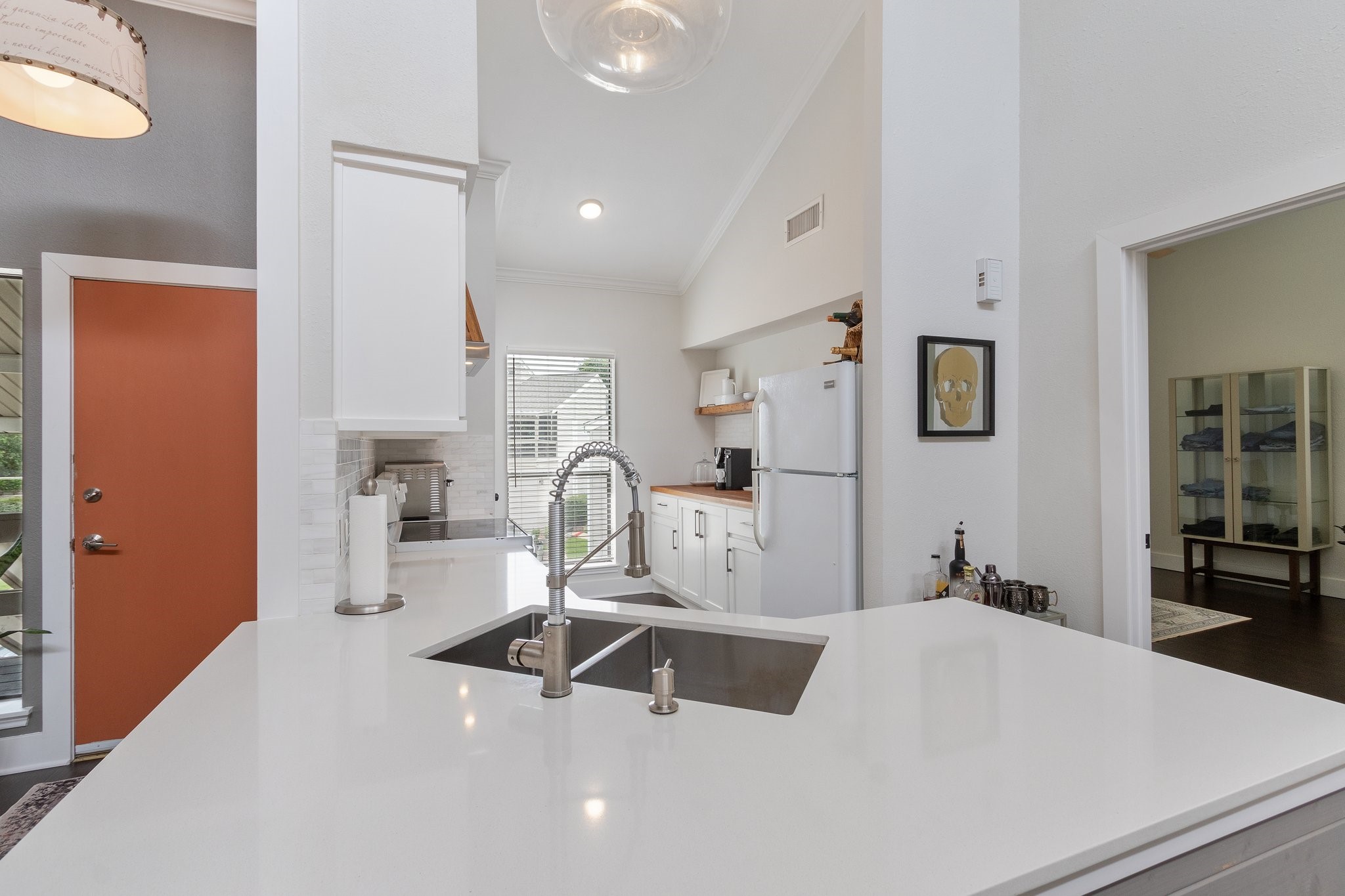 198 April Point Drive North Conroe, TX 77356 - Photo 16 of 34 a kitchen with sink refrigerator and cabinets
