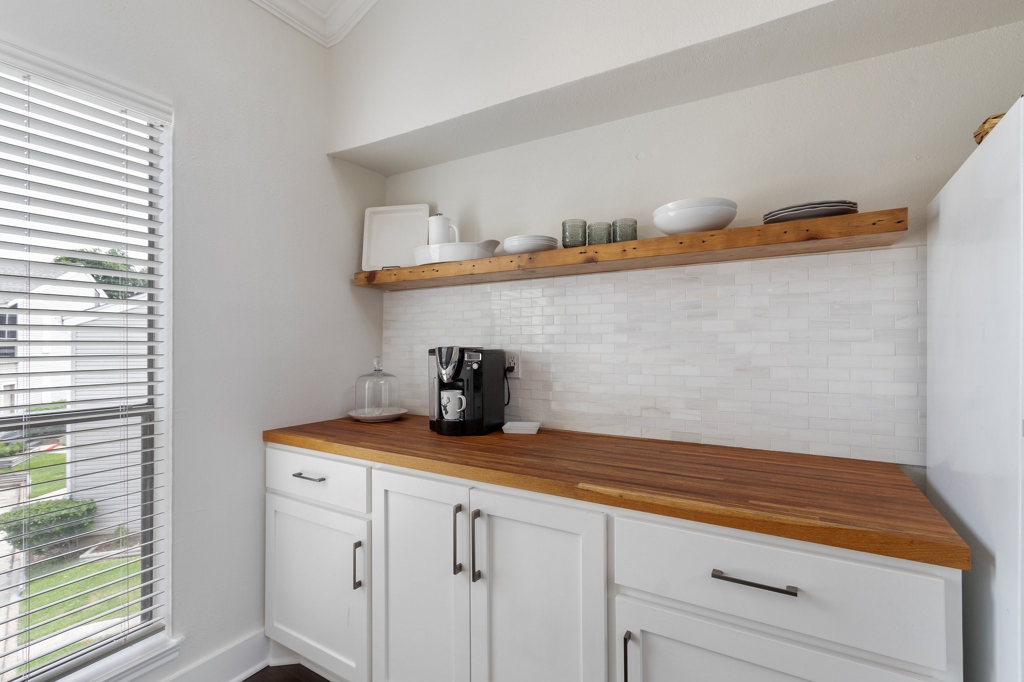 198 April Point Drive North Conroe, TX 77356 - Photo 20 of 34 a kitchen with a sink and cabinets
