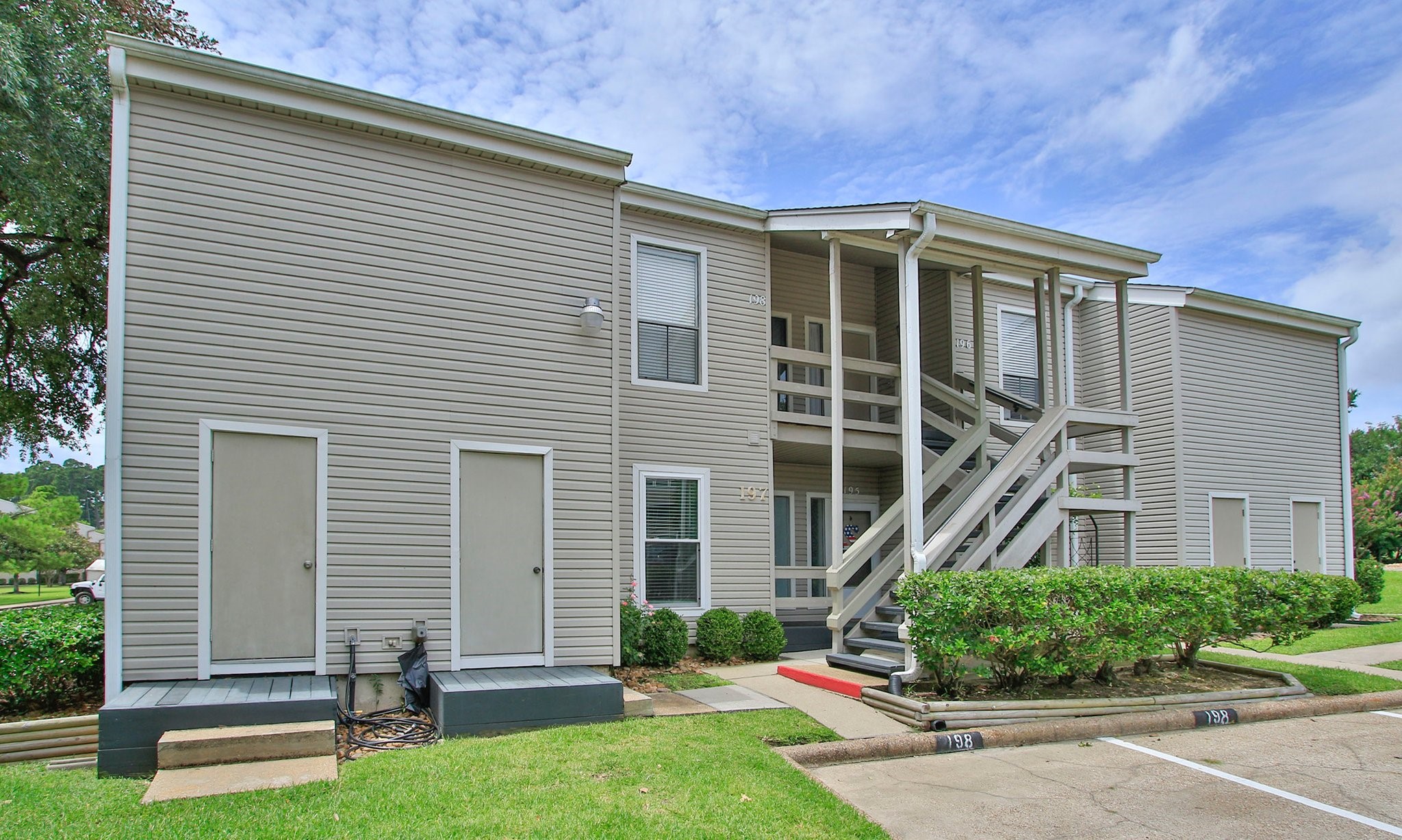198 April Point Drive North Conroe, TX 77356 - Photo 2 of 34 a front view of a house with a yard
