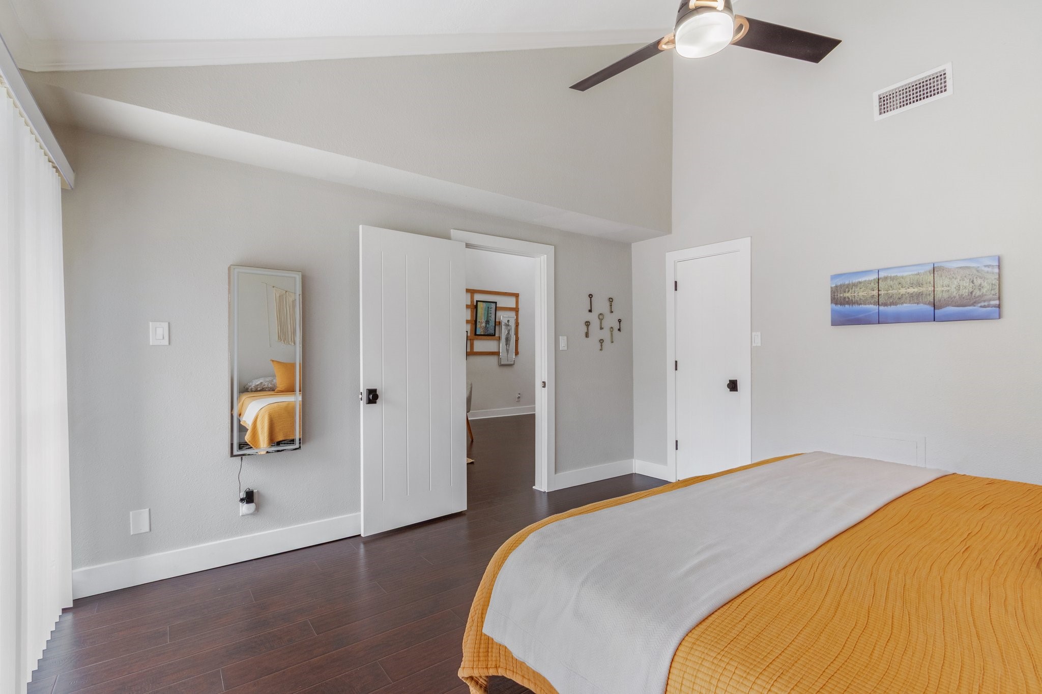 198 April Point Drive North Conroe, TX 77356 - Photo 22 of 34 a bedroom with a bed and a chandelier