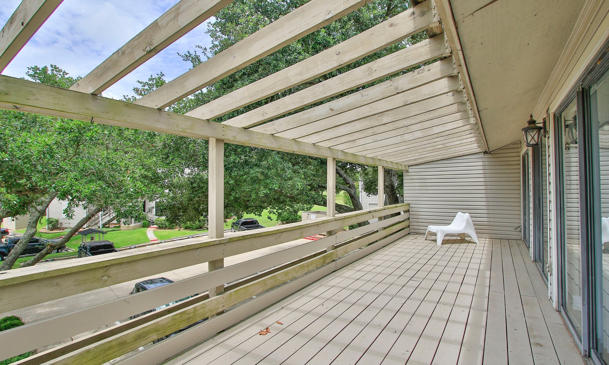 198 April Point Drive North Conroe, TX 77356 - Photo 26 of 34 a view of a balcony with wooden floor