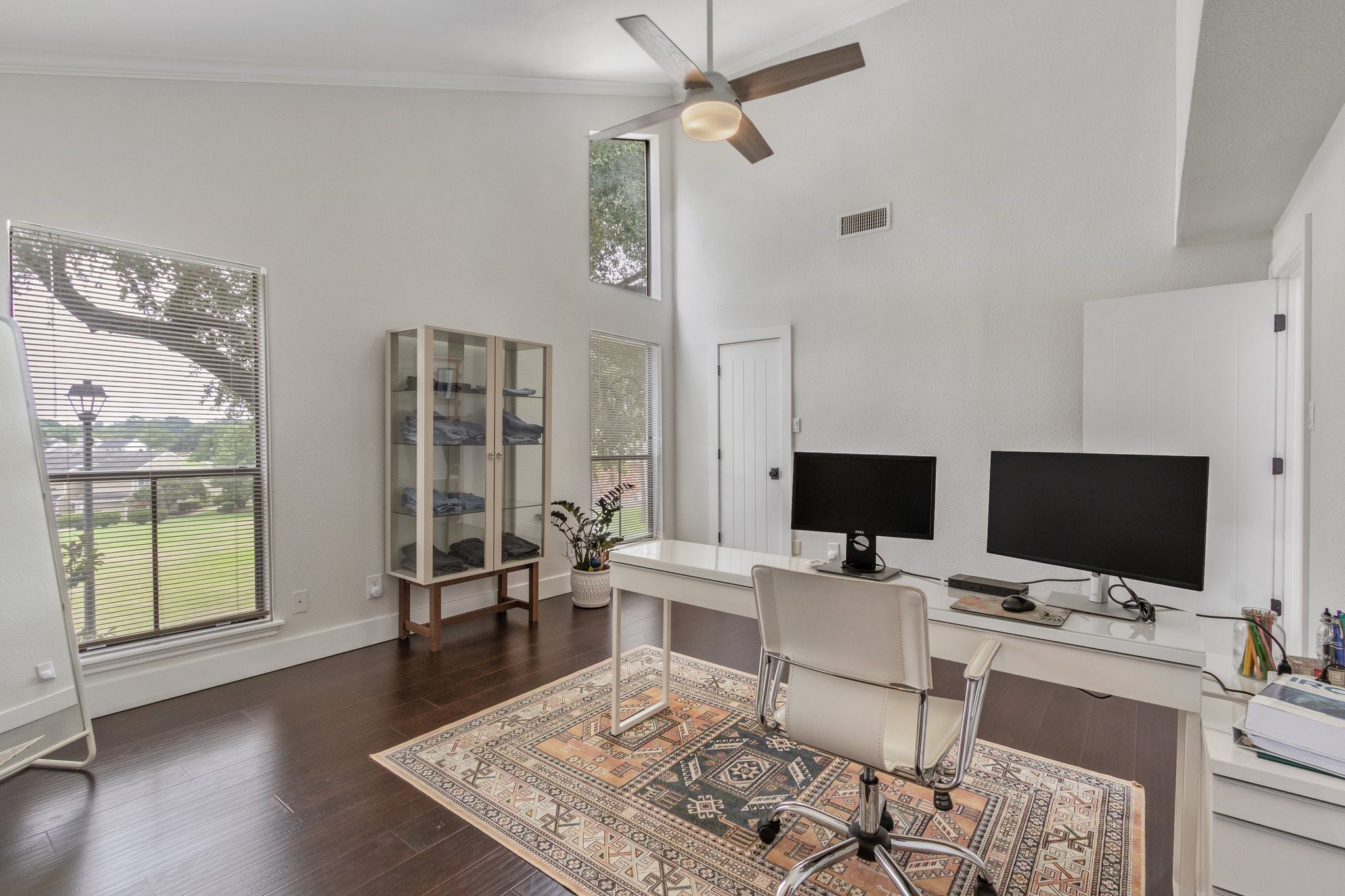 198 April Point Drive North Conroe, TX 77356 - Photo 29 of 34 a work room with furniture a flat screen tv and a floor to ceiling window