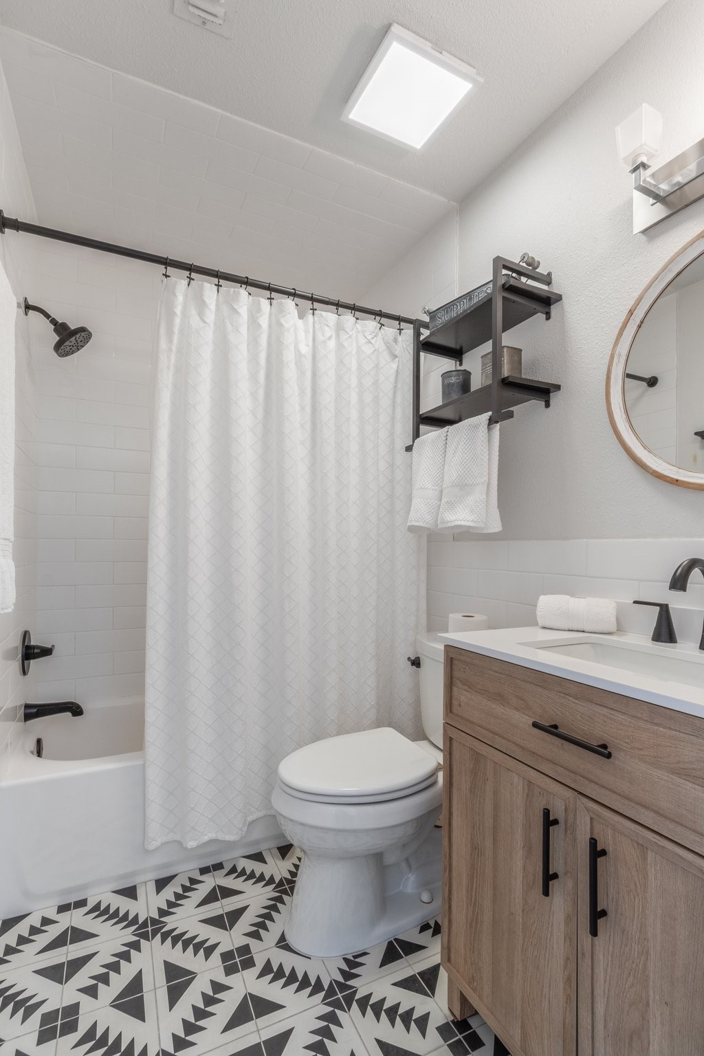 198 April Point Drive North Conroe, TX 77356 - Photo 32 of 34 a bathroom with a granite countertop sink toilet and shower