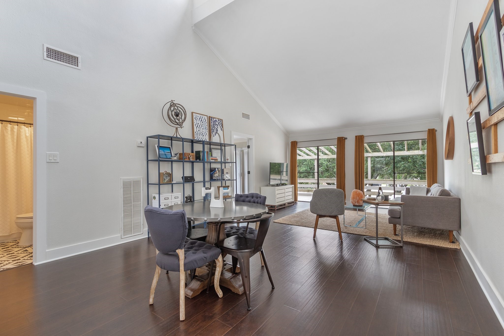 198 April Point Drive North Conroe, TX 77356 - Photo 7 of 34 a view of a dining room with furniture window and wooden floor
