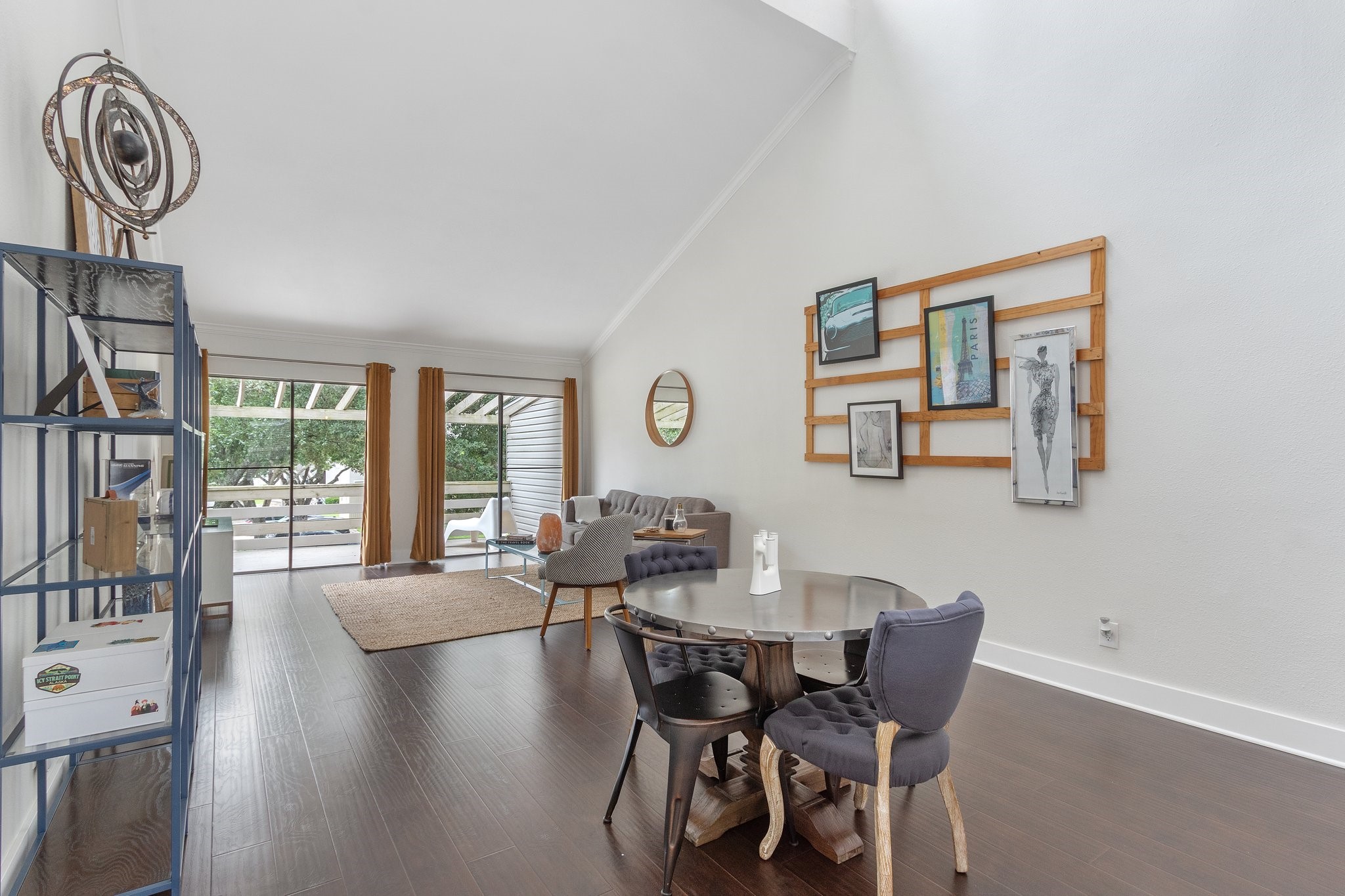 198 April Point Drive North Conroe, TX 77356 - Photo 8 of 34 a dining room with furniture a large window and wooden floor