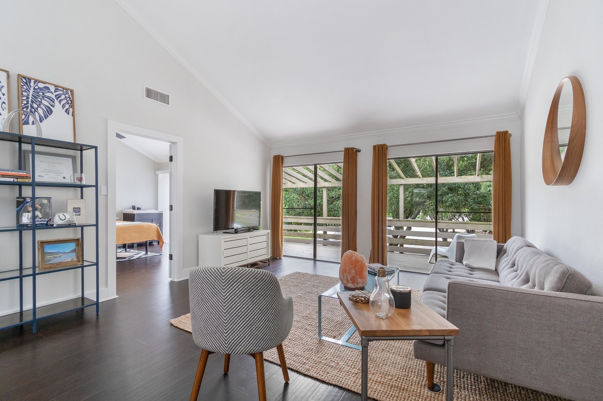 198 April Point Drive North Conroe, TX 77356 - Photo 10 of 34 a living room with furniture and a flat screen tv