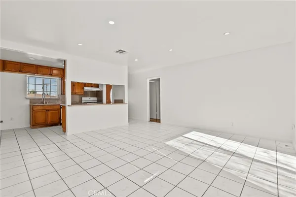 a view of a kitchen with furniture and cabinets