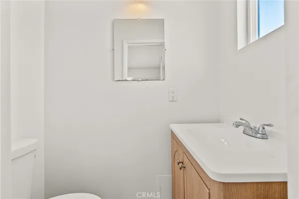 a bathroom with a sink and mirror
