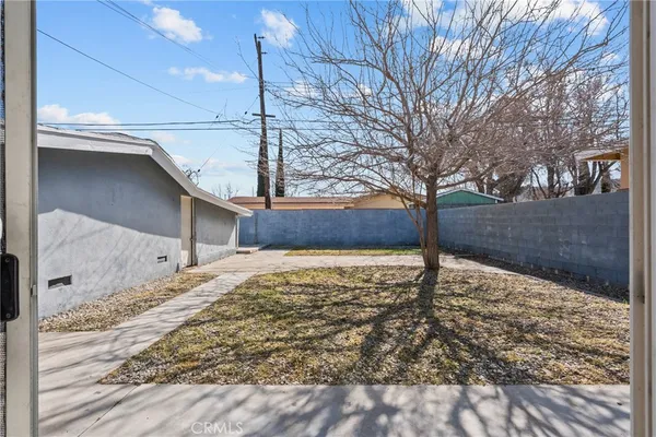 a view of a backyard of the house