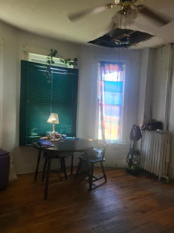 a workspace with furniture window and wooden floor