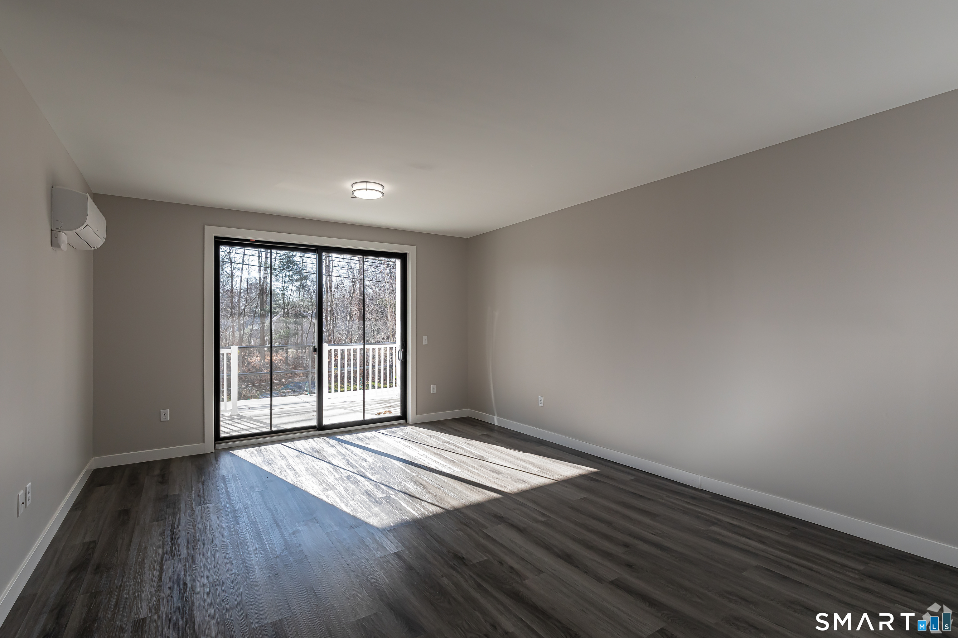 401 Albany Turnpike, Unit 213 Canton, CT 06019 - Photo 4 of 11 wooden floor in an empty room with a window
