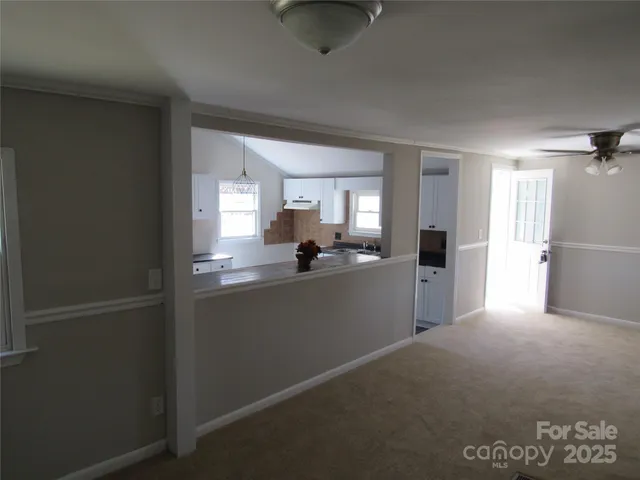 a kitchen with a refrigerator and a sink