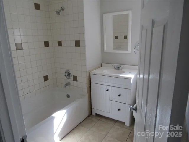 a bathroom with a bathtub and a sink
