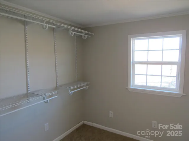 a view of a room that has a window in it