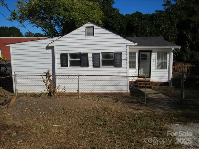 a front view of a house with yard