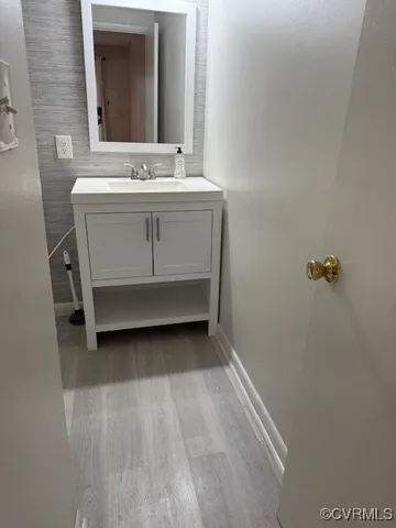 a white toilet sitting next to a shower