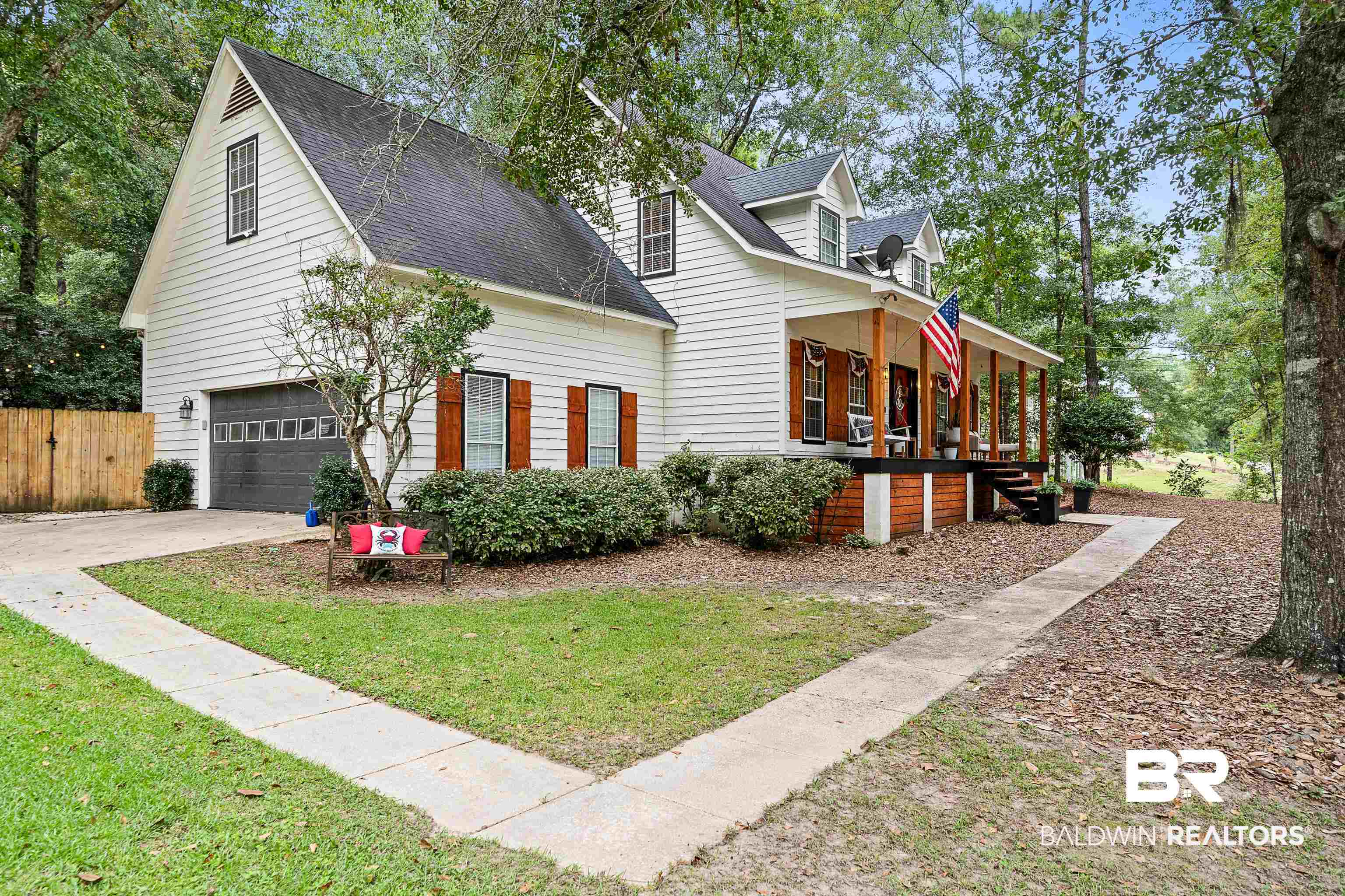 619 Ridgewood Drive Daphne, AL 36526 - Photo 3 of 47 View of front facade with a porch, a shingled roof, a garage, and driveway