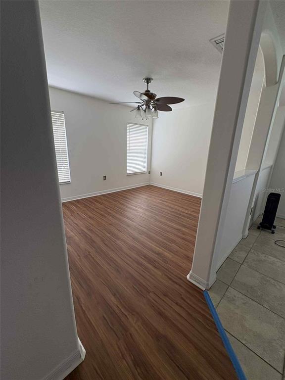 15813 Southwest 16th Avenue Road Ocala, FL 34473 - Photo 15 of 33 wooden floor in an empty room with a window