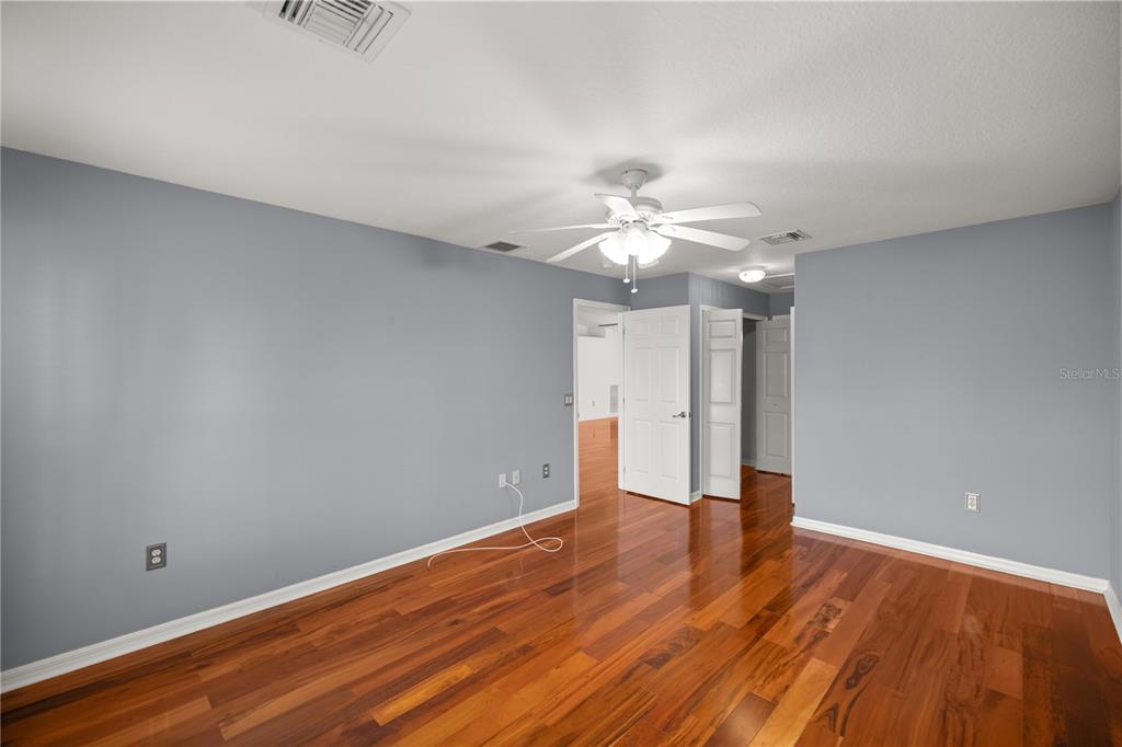 15813 Southwest 16th Avenue Road Ocala, FL 34473 - Photo 17 of 33 a view of an empty room with wooden floor