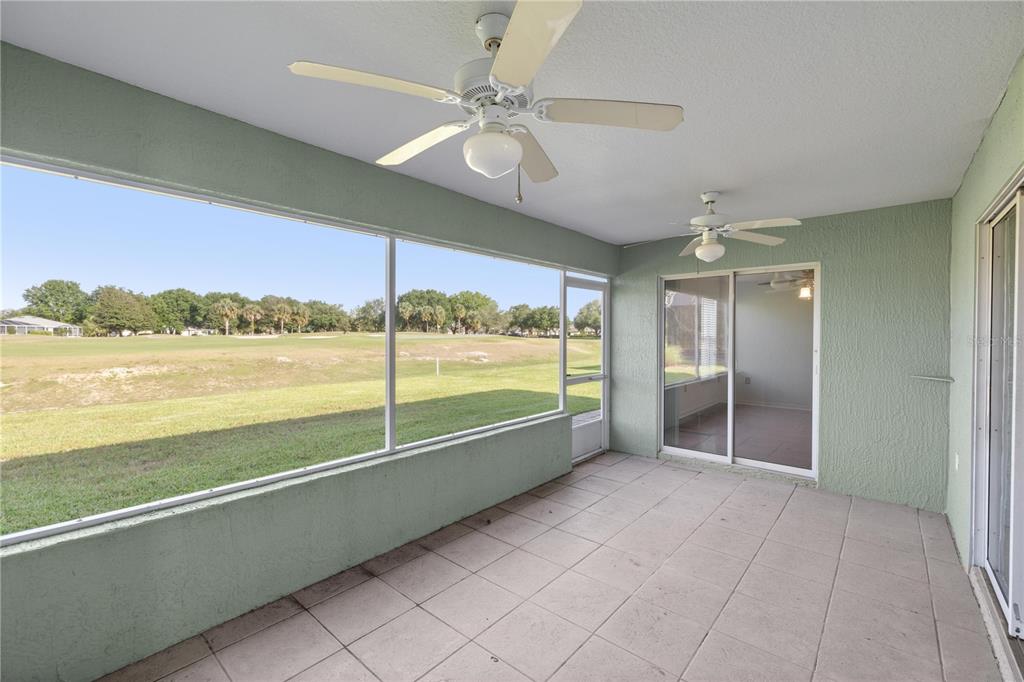 15813 Southwest 16th Avenue Road Ocala, FL 34473 - Photo 26 of 33 a view of empty room with wooden floor and fan