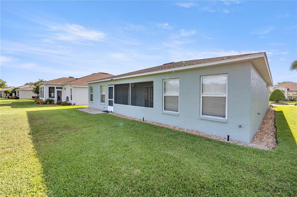 15813 Southwest 16th Avenue Road Ocala, FL 34473 - Photo 27 of 33 a view of a house with a backyard