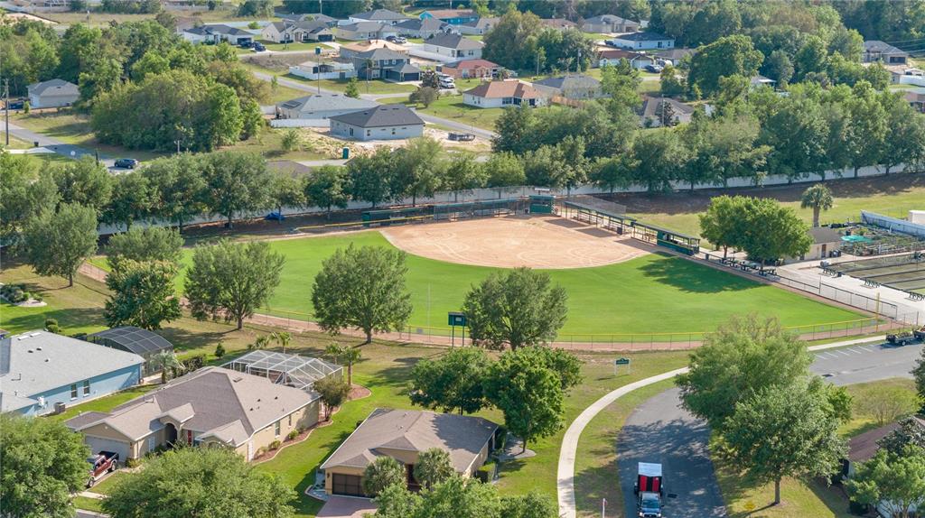 15813 Southwest 16th Avenue Road Ocala, FL 34473 - Photo 29 of 33 an aerial view of residential houses with outdoor space and lake view
